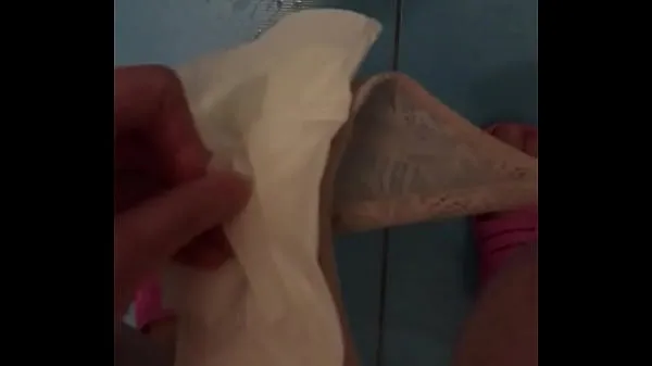 The girl shows pads during menstruation and pisses close-up أنبوب إجمالي جديد